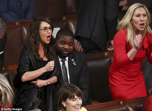 Rep. Lauren Boebert (left) and Rep. Marjorie Taylor Greene shout 