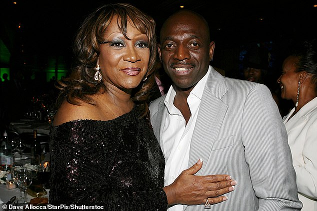 Hinton is pictured with Patti LaBelle in 2006