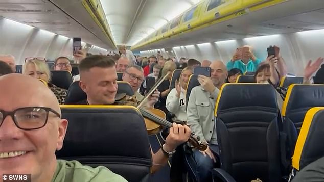 Video of the flight shows fellow passengers laughing, singing and clapping as the plane heads to the Canary Islands