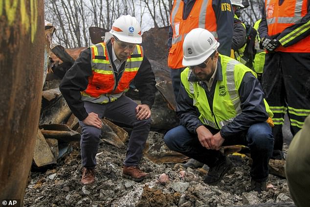 Transportation Secretary Pete Buttigieg, left, and Tristan Brown, deputy administrator of the Pipeline and Hazardous Materials Safety Administration, in East Palestine, shortly after the accident