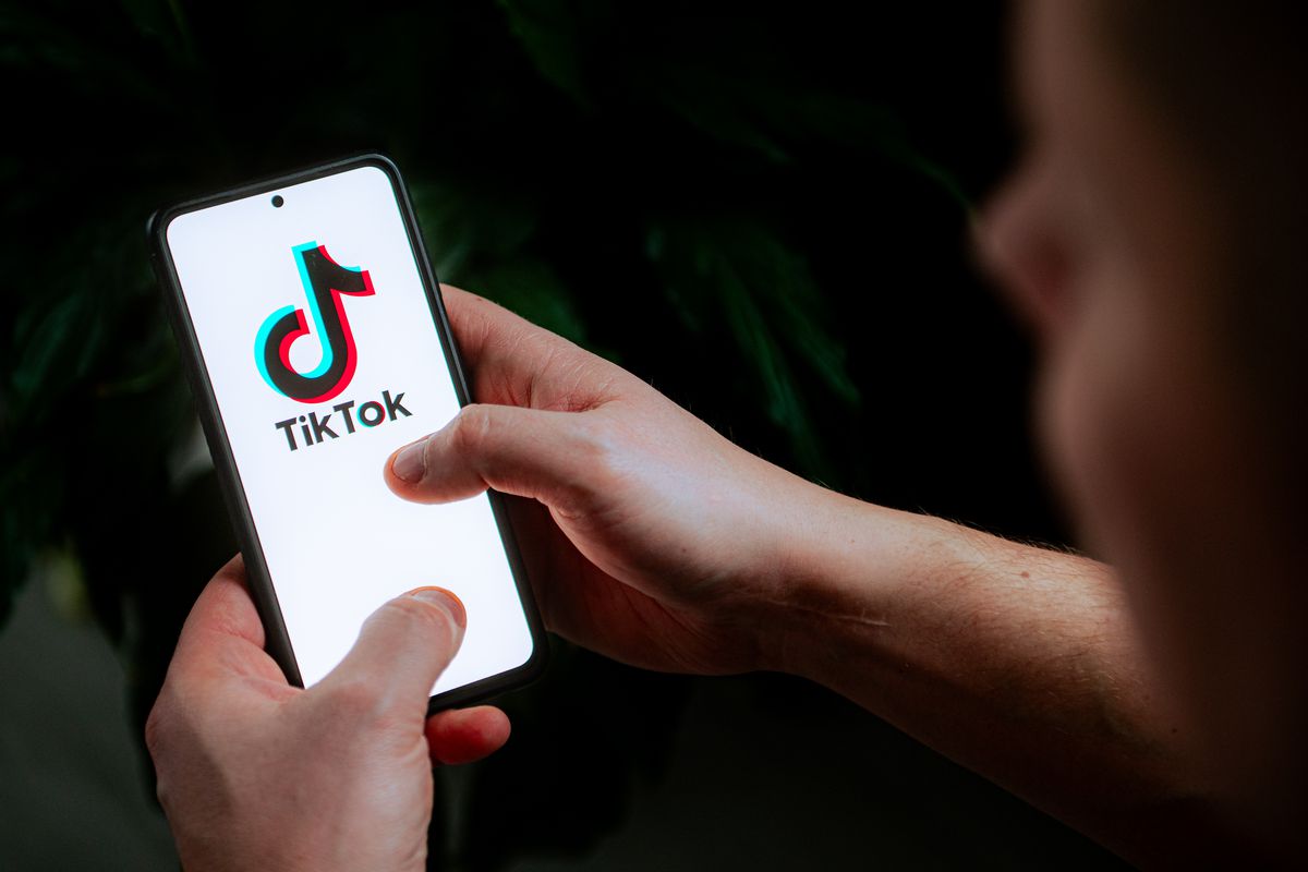 A photo illustration of a TikTok logo displayed on a mobile phone.