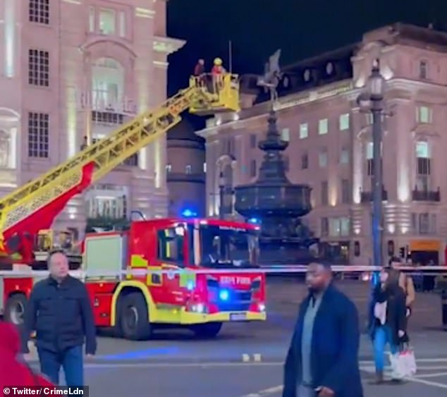 Images from later in the evening showed firefighters on an aerial platform addressing the man