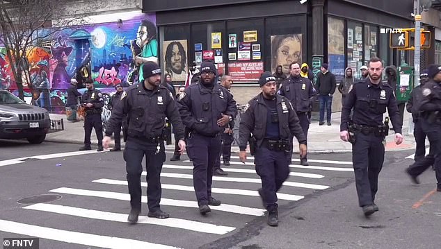 The incident began around 8:30 a.m. outside the East Village readmission center when a man tried to sneak into the large line, witnesses told The New York Post.