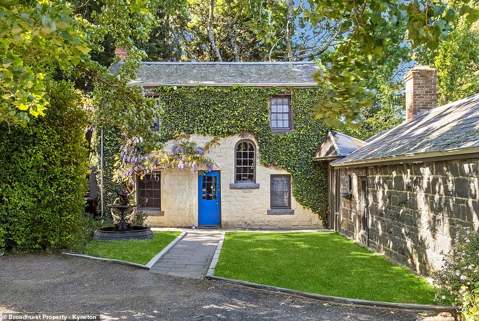 Behind the blue front door of the vineyard-covered estate in Victoria's Macedon Ranges lies a historic home where modern luxury meets historic charm