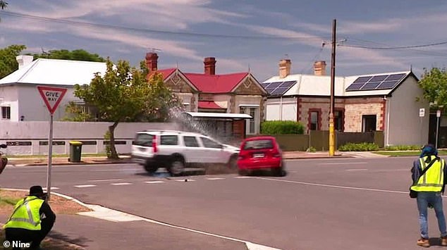 The staged crash was filmed on Port Road in Alberton, about 10km northwest of Adelaide, about 2pm on Friday, as South Australian Police Minister Joe Szakacs looked on.