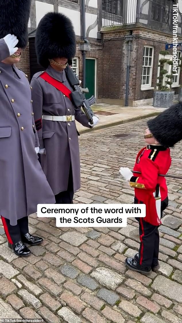 This is the heartwarming moment two royal guards made a rare break in protocol to greet a little fan wearing his own miniature uniform and bearskin