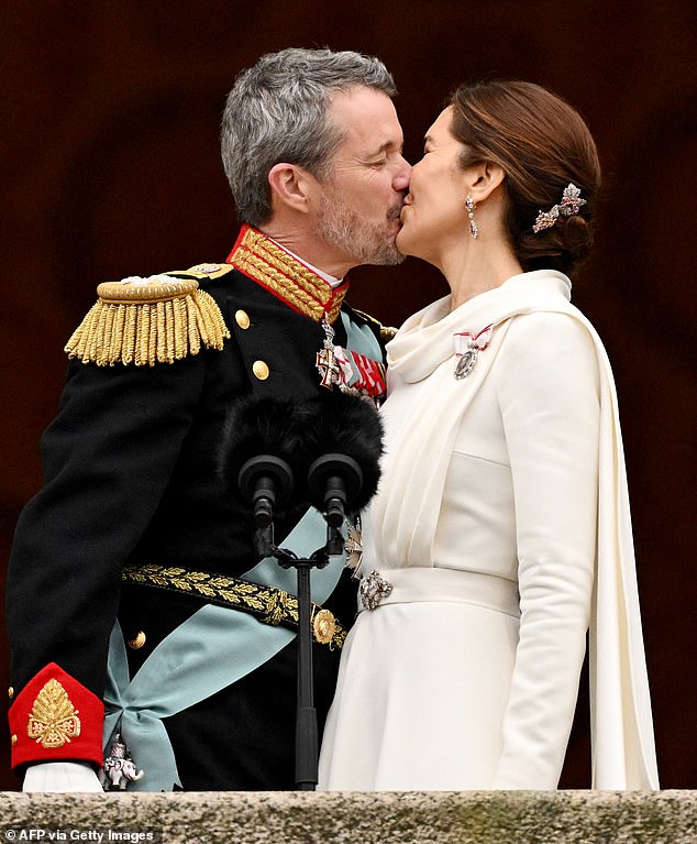 After becoming king on Sunday, a beaming Frederik took to the balcony of Christiansborg Palace, where he shared a public kiss with his wife - the newly crowned Queen Mary of Denmark