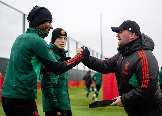 Marcus Rashford and Alejandro Garnacho greeted Littler next to a training pitch