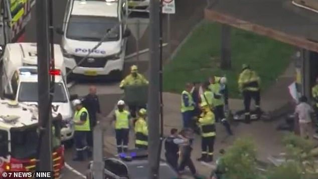 A man has been charged with a series of offenses after allegedly fleeing the scene when his van struck a woman walking on the footpath.  The photo shows emergency responders on site