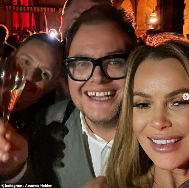 Amanda Holden rang in the new year in style on Sunday as she joined her best friend Alan Carr for a wild party at Estelle Manor