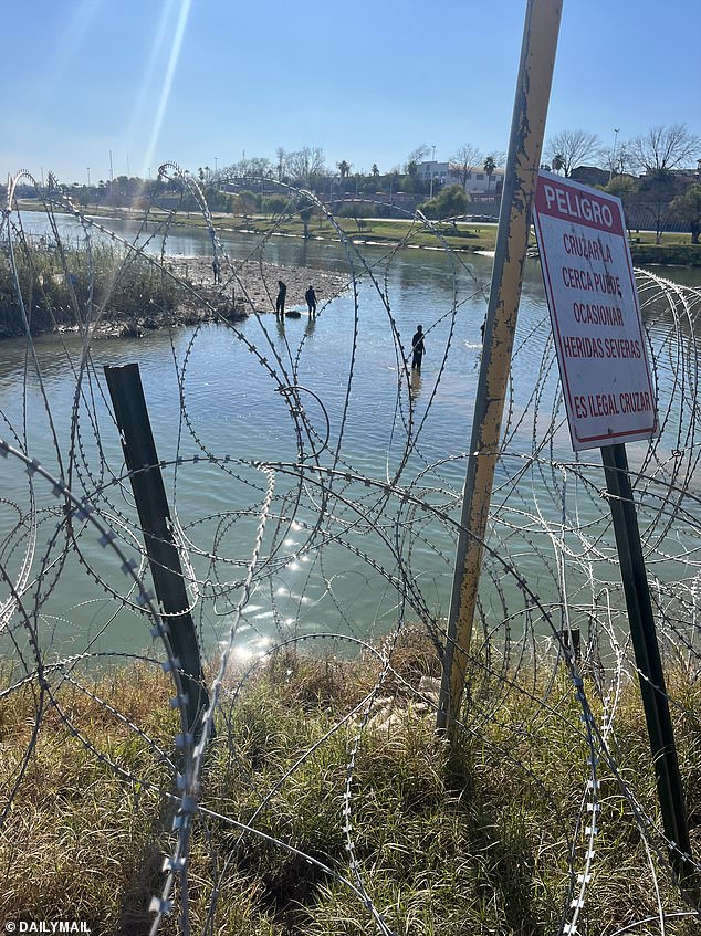 The migrant children then crawled onto the river bank and stepped through the concertina wire fence