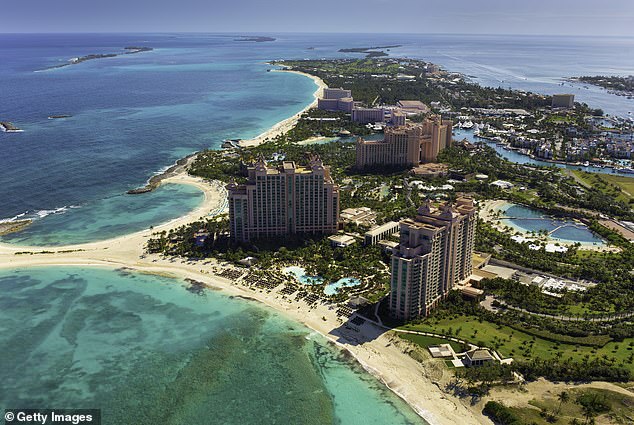 Police have not identified the resort, but Atlantis Paradise Island offers shark experiences on site