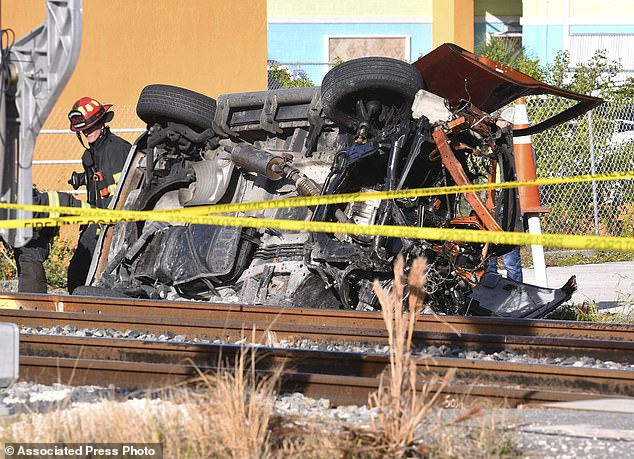 Emergency crews work at the scene where a Brightline passenger train collided with an SUV on January 10 in Melbourne, Florida