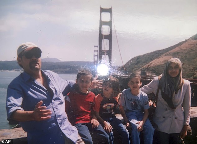 Father Abedalla's Sckak family (far left) with his wife Zahra (far right) and their three young sons who are all U.S. citizens.  Abedalla was killed last month while trying to flee from a building he was hiding in with his wife, who miraculously survived and was rescued on Sunday.