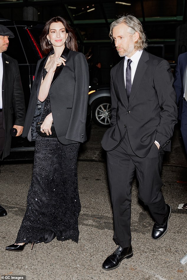 Anne Hathaway and her husband, Adam Shulman, appeared in good spirits during a rare outing in New York City on Thursday.  The 41-year-old actress and the film producer, 42, made a stylish duo who complemented black ensembles as they attended the National Board Of Review Awards Gala.