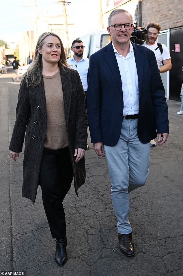 Prime Minister Anthony Albanese (pictured right with partner Jodie Haydon) had previously said the phase three cuts would come into effect as laid down in law