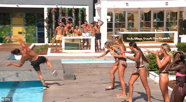 Anton Danyluk falls backwards into the pool after failing to impress Georgia Harrison during a game of Snog, Marry, Pie on Monday night's Love Island: All Stars