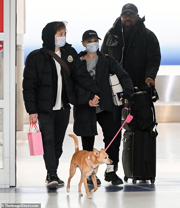 Ariana Grande and her boyfriend Ethan Slater were spotted holding hands as they landed together in New York City on Sunday