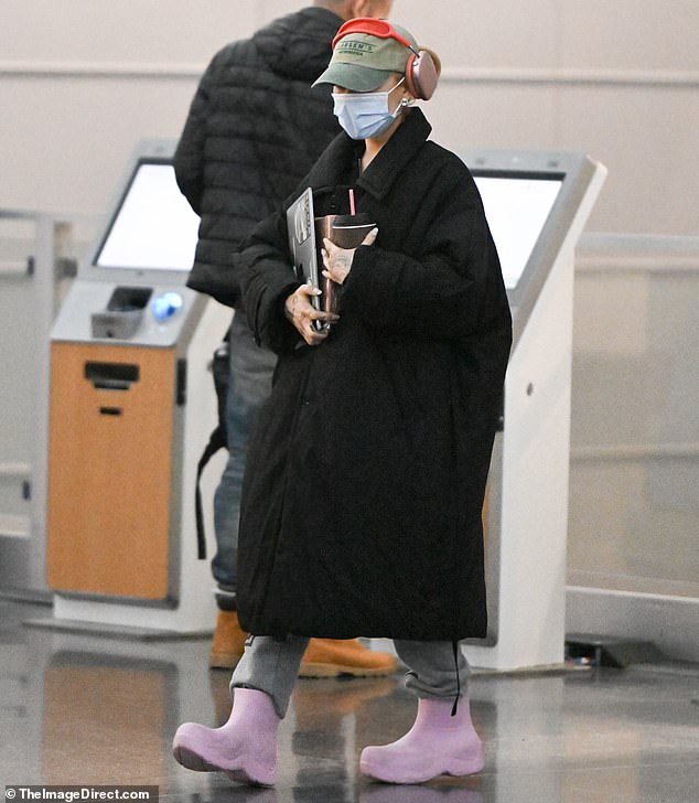 Ariana Grande was almost unrecognizable as she walked through New York's JFK airport on Saturday