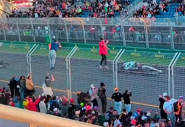 Terrifying footage showed several fans jumping over the barrier at the pit lane exit in Melbourne last year, while others climbed over the fence to watch the race from a dangerous height.