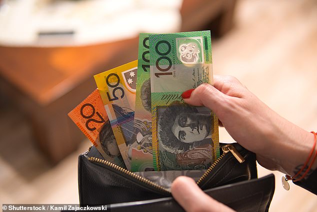 As many Australians become increasingly concerned about the rapid decline in the use of cash, an outraged woman has taken to social media to complain about the costs of using cash.  The photo shows a woman taking cash from a wallet