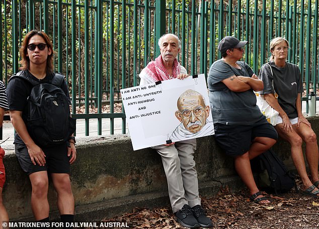 One man held a sign calling for truth, justice and equality