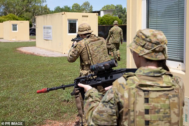 Australian soldiers are pictured conducting mission training before heading to Britain to help train Ukrainian soldiers