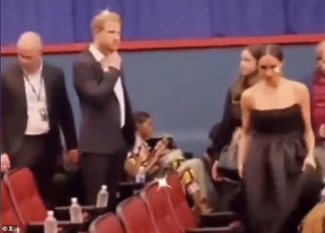 Video showed the couple making their way to their seats – which appeared to be a few rows away – at the film premiere