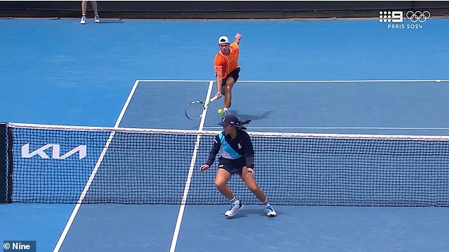 An Australian Open ball kid ran onto the court to get a ball midway through a rally