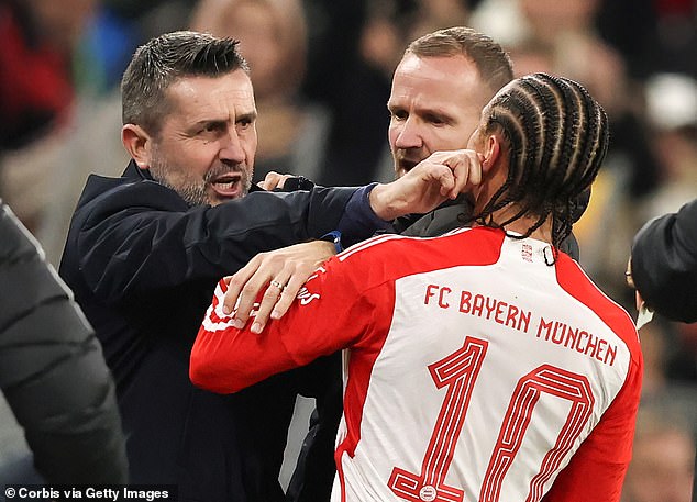 Bayern Munich star Leroy Sane is shoved in the face by Union Berlin boss Nenad Bjelica (left)