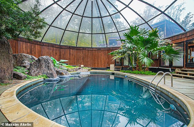 The house features seven bedrooms, six bathrooms and a terrarium-like indoor pool, complete with a domed glass roof