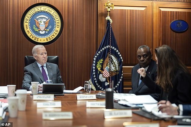 resident Joe Biden receives the Presidential Daily Briefing, Monday, Jan. 29, 2024, in the White House Situation Room at the White House in Washington, as Secretary of Defense Lloyd Austin listens