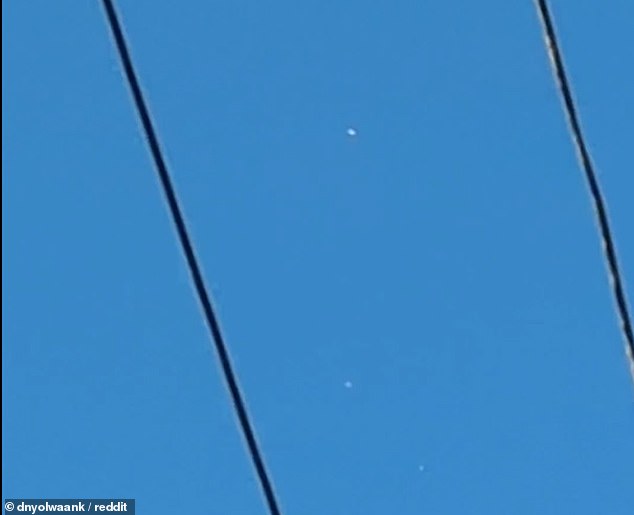 Mysterious footage shows a group of UFOs flying over Philadelphia – with two of the craft even strangely merging together