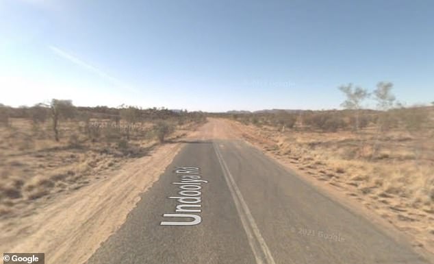 Police are treating the death of a 19-year-old man as suspicious after his lifeless body was discovered on the remote Undoolya Road (pictured), east of Alice Springs, on Monday.