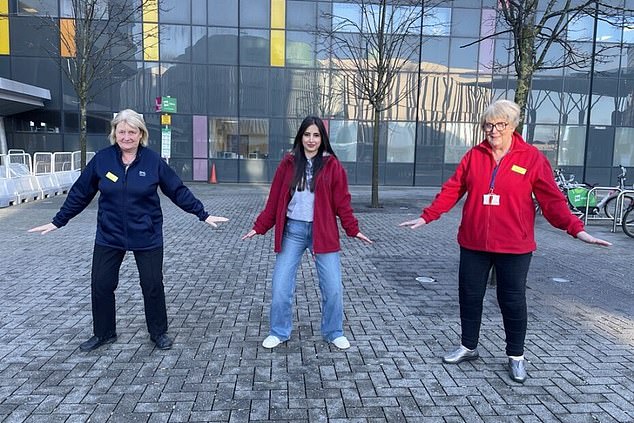 Walking with your legs apart, a gentle knee bend and extended arms can reduce the risk of losing balance on the ice, according to NHS Greater Glasgow and Clyde.  Pictured: NHSGGC staff demonstrating the penguin walking position