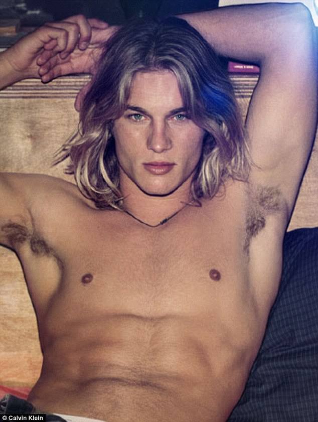 He's the handsome Australian model who once starred in a series of sultry Calvin Klein underwear ads, but Travis Fimmel looks worlds away from his days as an early 2000s pin-up in his new Netflix series Boy Swallows Universe.  (Travis pictured in Calvin Klein's 2002 ad)