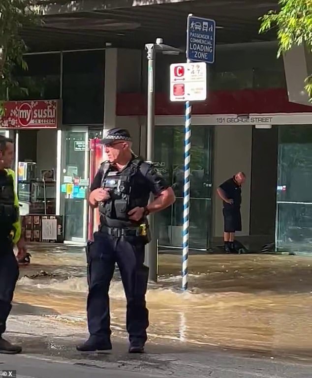 Water is flowing through the streets and into shops in Brisbane's CBD after a major leak