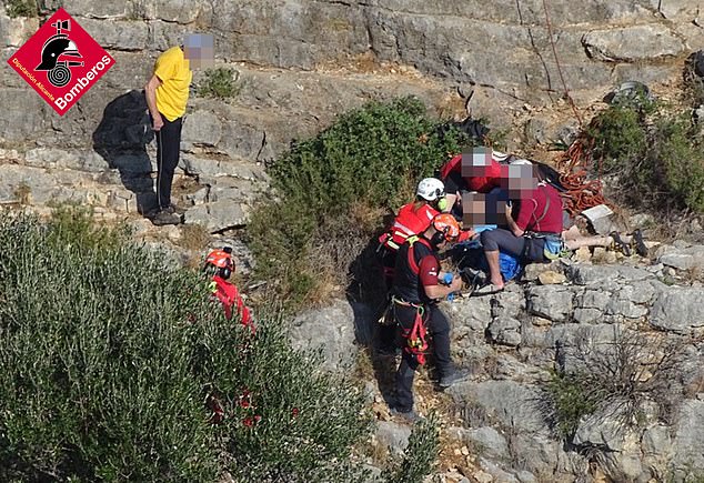 Emergency services provide assistance to the man at the scene of the accident