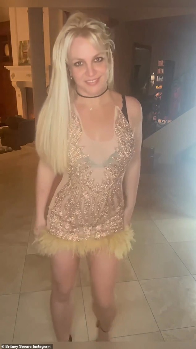 Britney Spears shared a flirty video of herself dressed in a sparkling gold mini dress on Tuesday