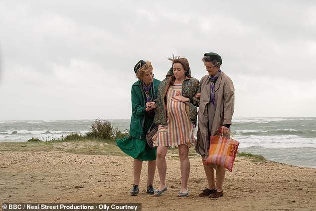 Call The Midwife was thrown into chaos as the cast filmed during Storm Agnes and battled 60mph winds in West Wittering on the West Sussex coast (Linda Bassett, Lydia Fleming and Georgie Glen pictured L-R)