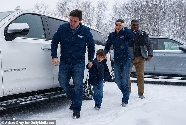 Florida Gov. Ron DeSantis, his son Mason and his wife Casey arrive Friday at a surprise campaign stop at his campaign headquarters in Urbandale, Iowa.  Casey headlined separate events of her husband's to get the message across