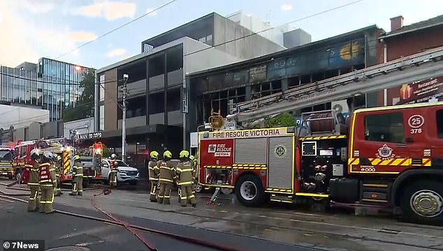 Flames were seen from the second floor of a building on Hawthorn Road in Caufield North, in the city's south-east, at around 5am on Monday (photo, fire brigade on scene)