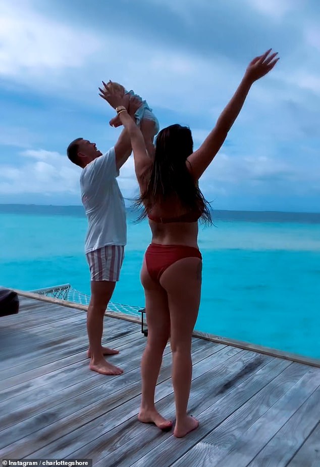 The former Geordie Shore star, 33, took to Instagram to share a clip of the trio standing on a deck above the calm azure sea