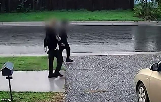 The family's CCTV footage caught two teenagers hanging out on the residential street on Friday