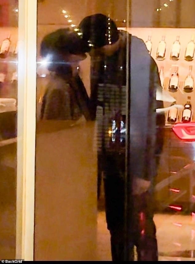 The couple stole a kiss at the Funke cafe in Beverly Hills