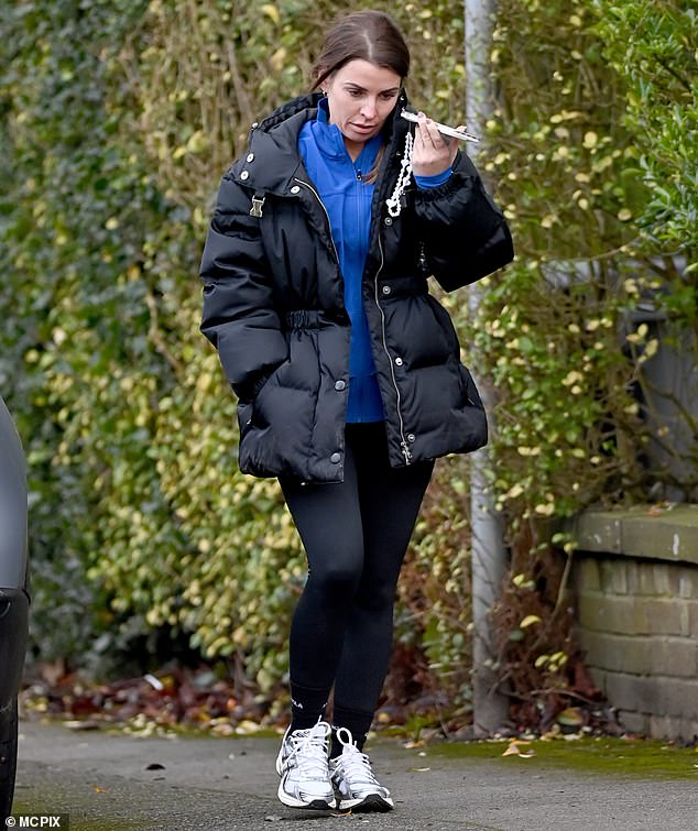 The WAG, 37, stepped out in Cheshire keeping warm in a black padded jacket and matching leggings