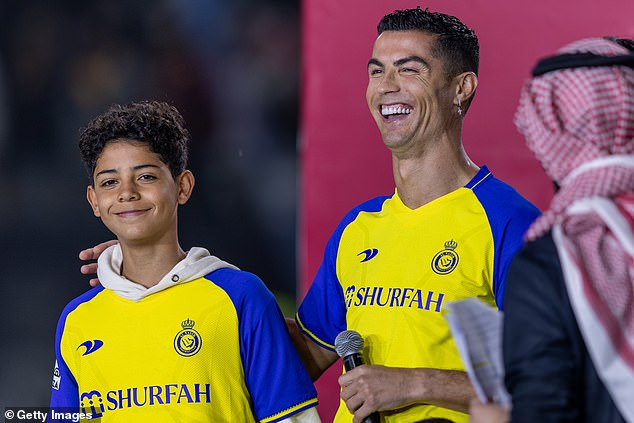 Cristiano Ronaldo's son Ronaldo Jnr (left) shows signs of following in his father's footsteps