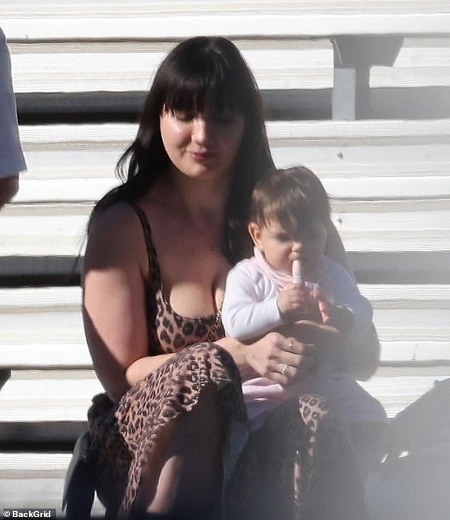 Daisy Lowe doted on her nine-month-old daughter Ivy as she attended a soccer match in LA on Sunday