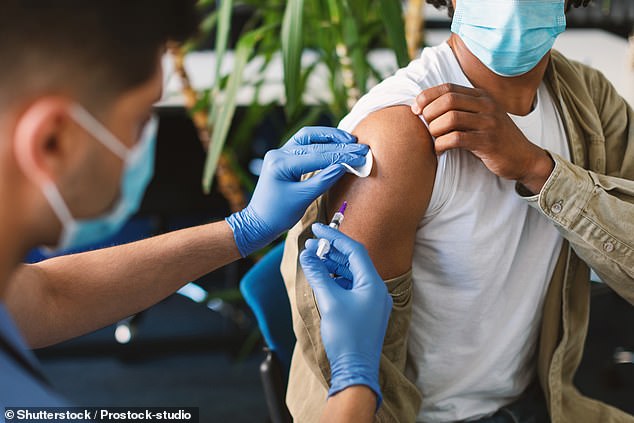 A civil servant who was forced to get a Covid vaccination to keep his job but then fell seriously ill has won a major legal victory involving compensation and payment of medical bills.  A man is shown receiving a vaccination against Covid-19