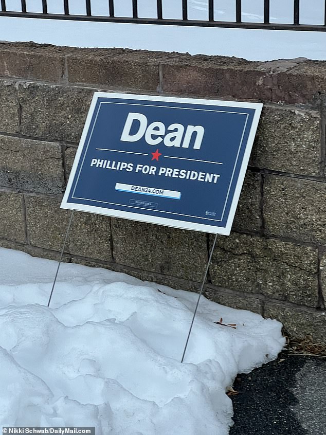 A sign for Dean Phillips stands in the snow near a polling place in downtown Manchester, New Hampshire.  The Minnesota congressman received 21 percent of the vote from Granite State Democrats.  President Joe Biden's name was not on the ballot